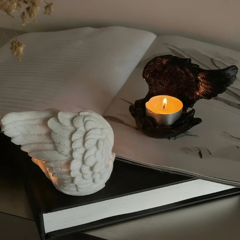 Celestial angel wings resin candle holder with intricate feathered detail and ethereal glow 2