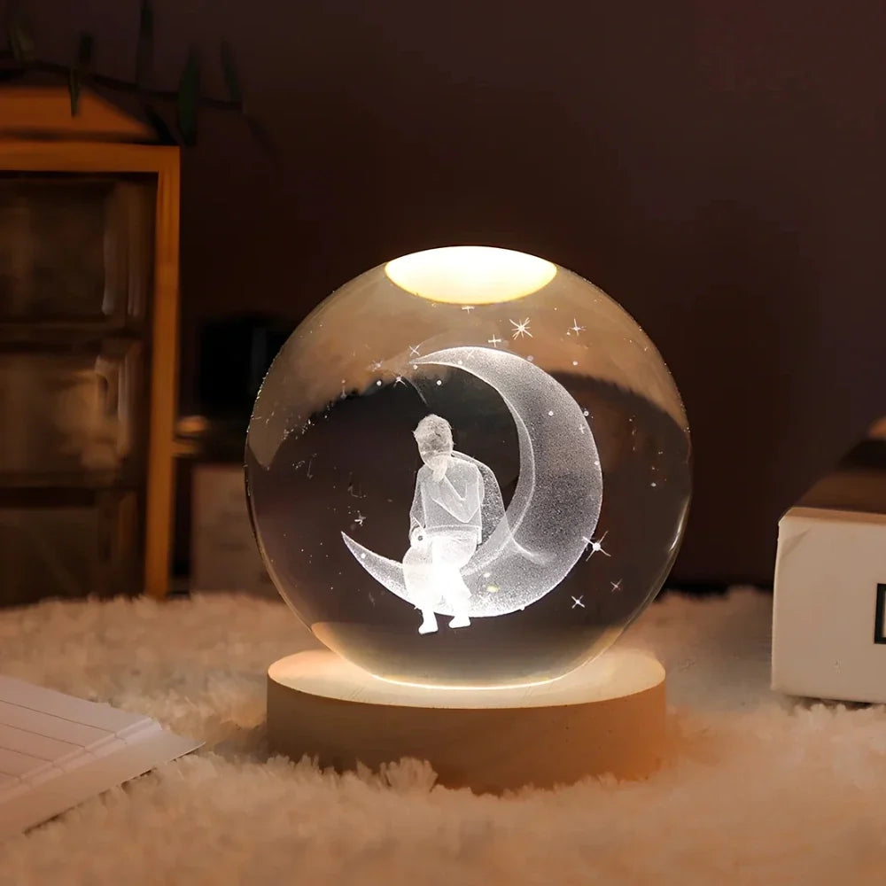 Luminous crystal ball with 3D engraved planets and space scenes, warm white LED glow 11