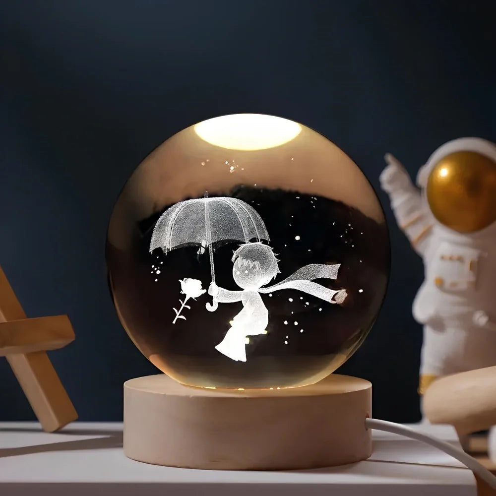 Luminous crystal ball with 3D engraved planets and space scenes, warm white LED glow 15