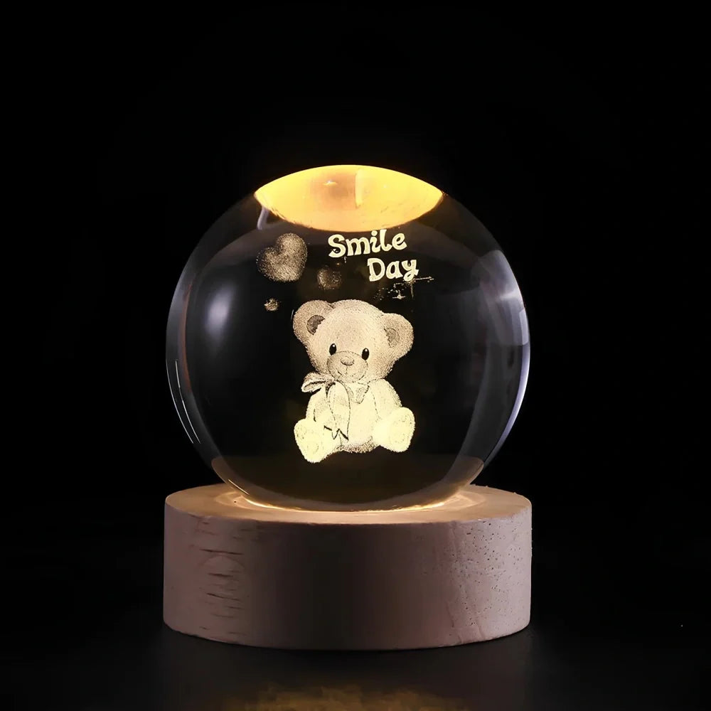 Luminous crystal ball with 3D engraved planets and space scenes, warm white LED glow 18