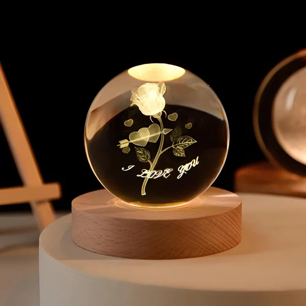 Luminous crystal ball with 3D engraved planets and space scenes, warm white LED glow 21