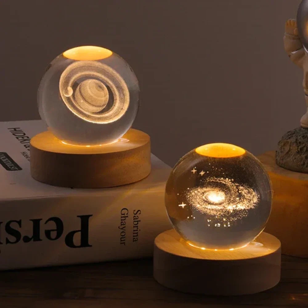 Luminous crystal ball with 3D engraved planets and space scenes, warm white LED glow 28