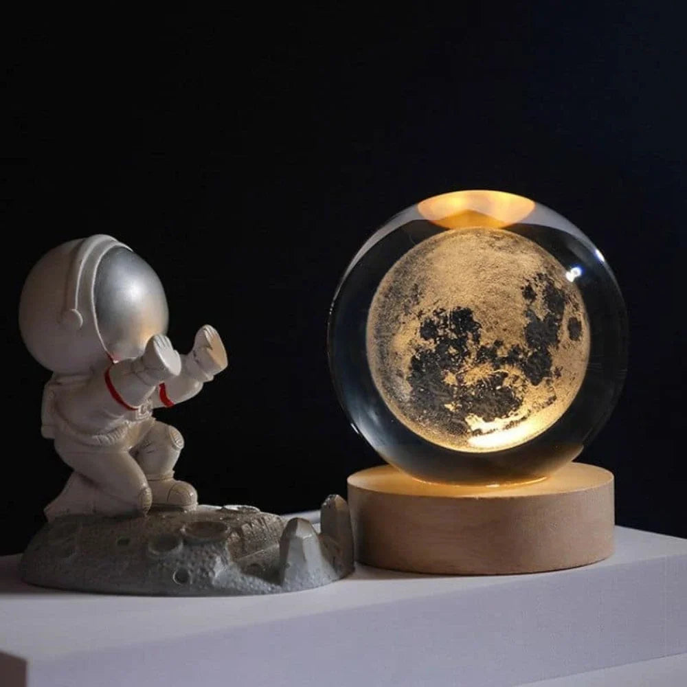 Luminous crystal ball with 3D engraved planets and space scenes, warm white LED glow 4