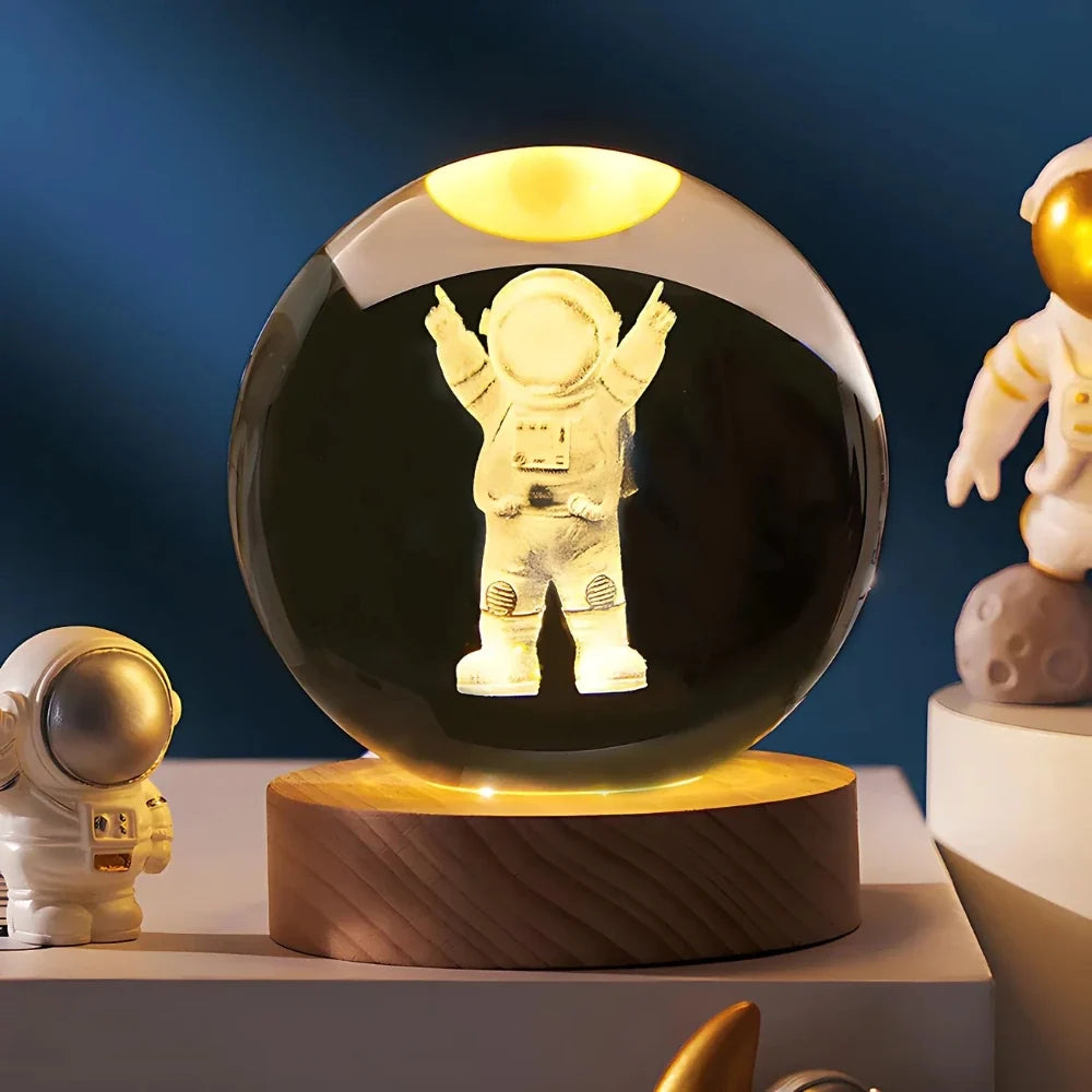 Luminous crystal ball with 3D engraved planets and space scenes, warm white LED glow 5