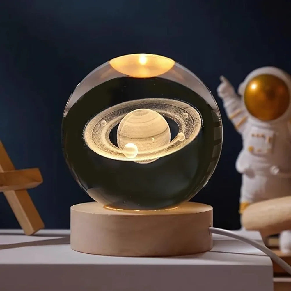 Luminous crystal ball with 3D engraved planets and space scenes, warm white LED glow 6