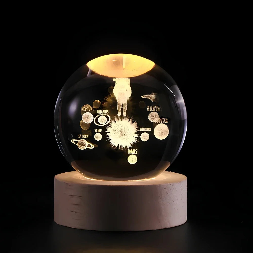 Luminous crystal ball with 3D engraved planets and space scenes, warm white LED glow 7