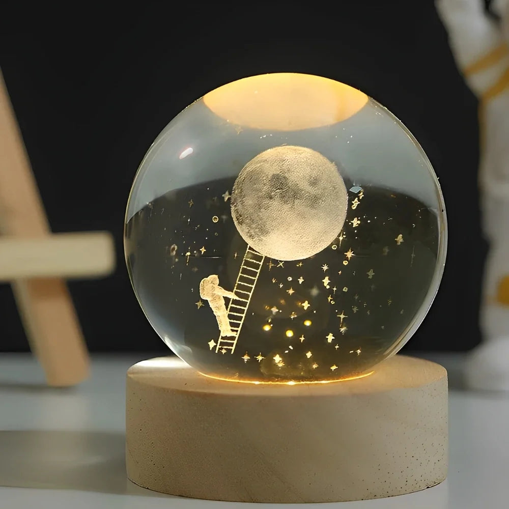 Luminous crystal ball with 3D engraved planets and space scenes, warm white LED glow 8
