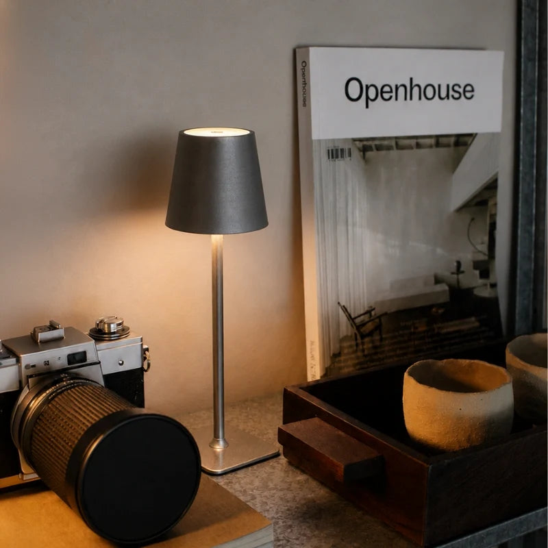 Cordless dimmable tall table lamp with sleek metal stem and warm LED light. 13
