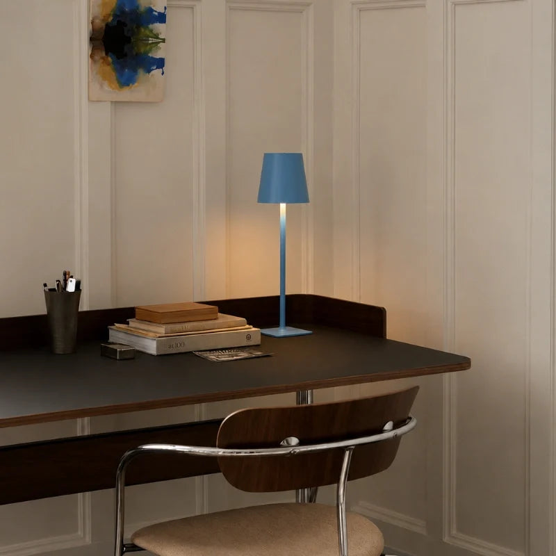 Cordless dimmable tall table lamp with sleek metal stem and warm LED light. 15