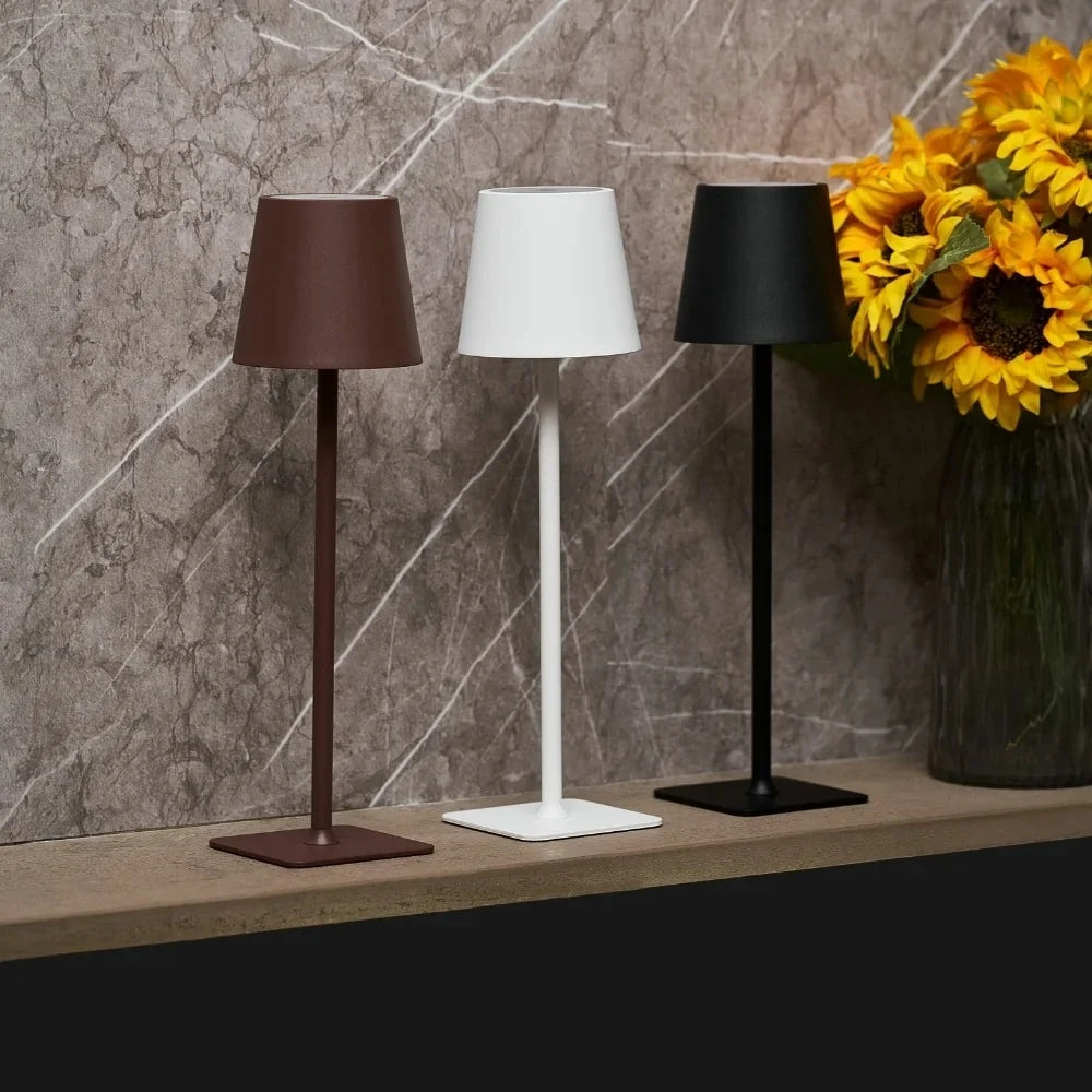 Cordless dimmable tall table lamp with sleek metal stem and warm LED light. 2