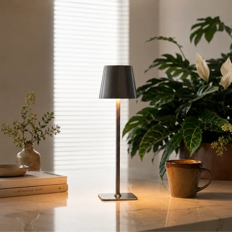 Cordless dimmable tall table lamp with sleek metal stem and warm LED light. 21