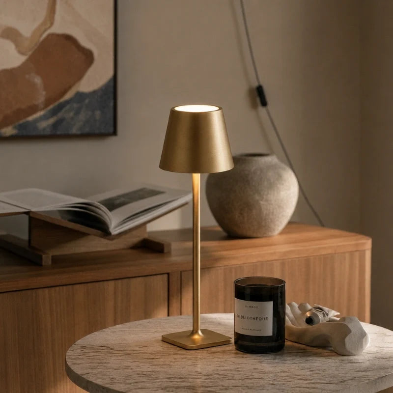 Cordless dimmable tall table lamp with sleek metal stem and warm LED light. 26