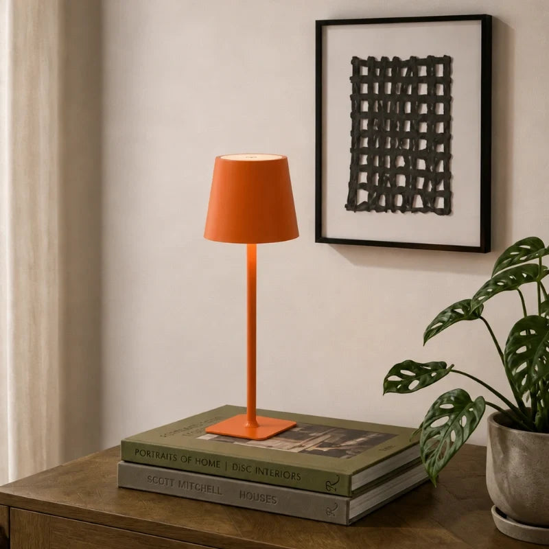 Cordless dimmable tall table lamp with sleek metal stem and warm LED light. 27