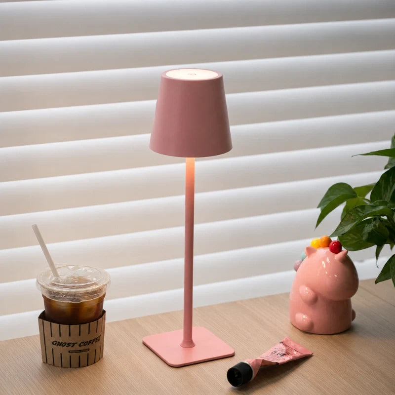 Cordless dimmable tall table lamp with sleek metal stem and warm LED light. 28