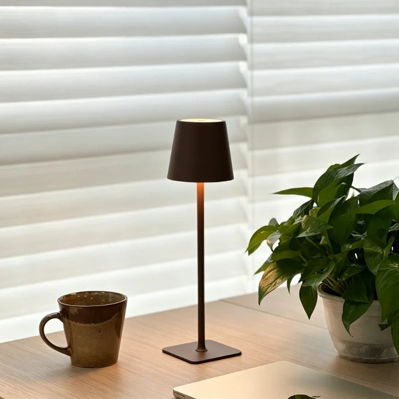 Cordless dimmable tall table lamp with sleek metal stem and warm LED light. 31