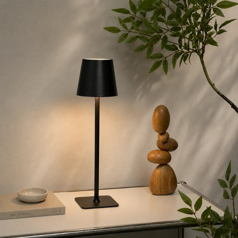 Cordless dimmable tall table lamp with sleek metal stem and warm LED light. 35