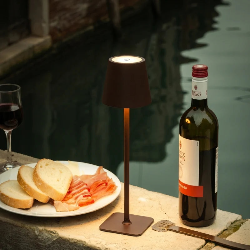 Cordless dimmable tall table lamp with sleek metal stem and warm LED light. 36