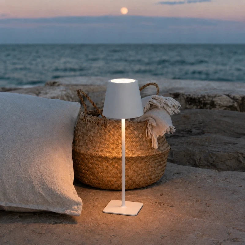 Cordless dimmable tall table lamp with sleek metal stem and warm LED light. 37