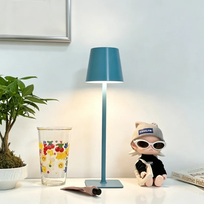Cordless dimmable tall table lamp with sleek metal stem and warm LED light. 39