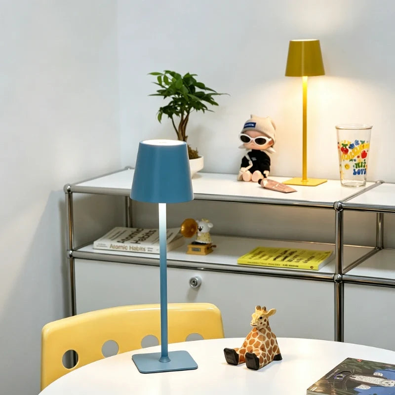 Cordless dimmable tall table lamp with sleek metal stem and warm LED light. 40