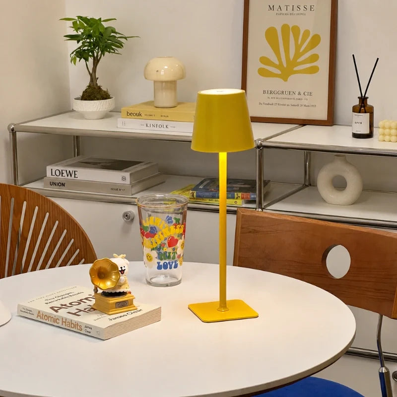 Cordless dimmable tall table lamp with sleek metal stem and warm LED light. 41