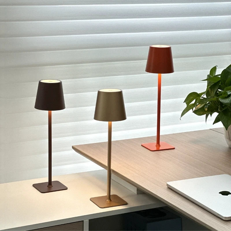 Cordless dimmable tall table lamp with sleek metal stem and warm LED light. 42