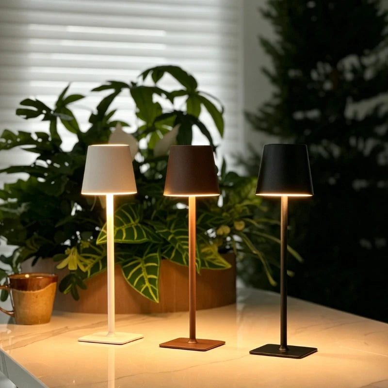 Cordless dimmable tall table lamp with sleek metal stem and warm LED light. 43