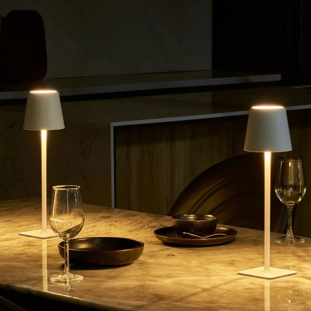 Cordless dimmable tall table lamp with sleek metal stem and warm LED light. 9