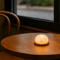 Handcrafted cordless mineral glow lamp with warm ambient light on a table 4