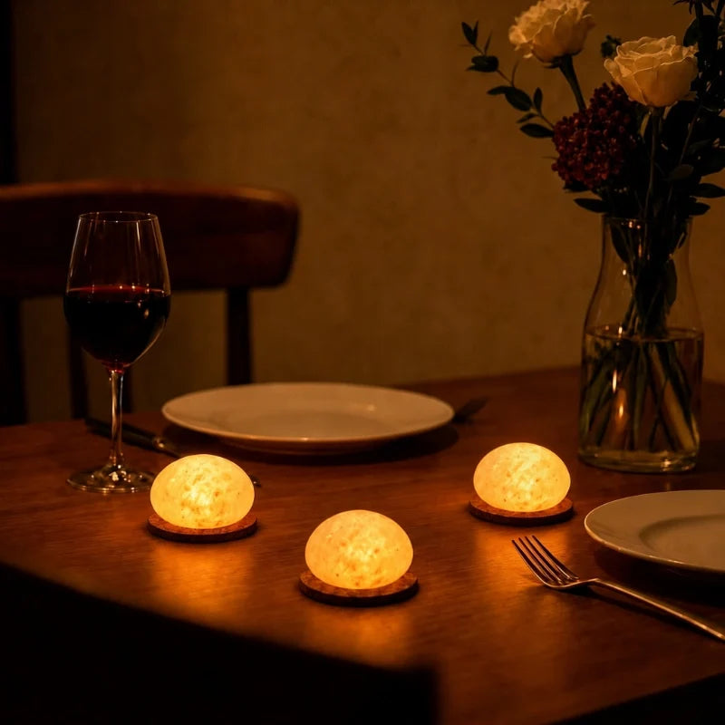 Handcrafted cordless mineral glow lamp with warm ambient light on a table 9