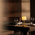 Cordless pleated fabric table lamp with elegant iron base and rechargeable LED lighting