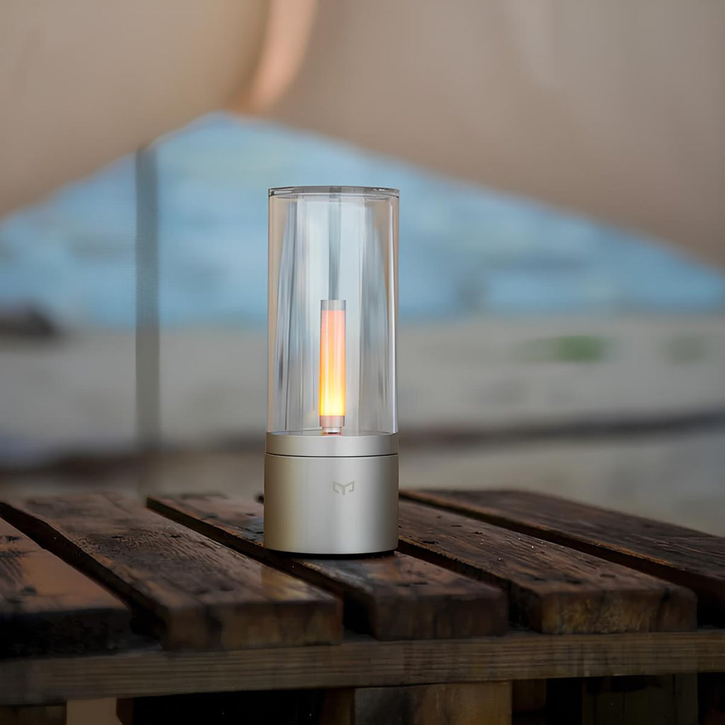 Dimmable cylindrical table lamp with clear glass body and warm white light glow 3