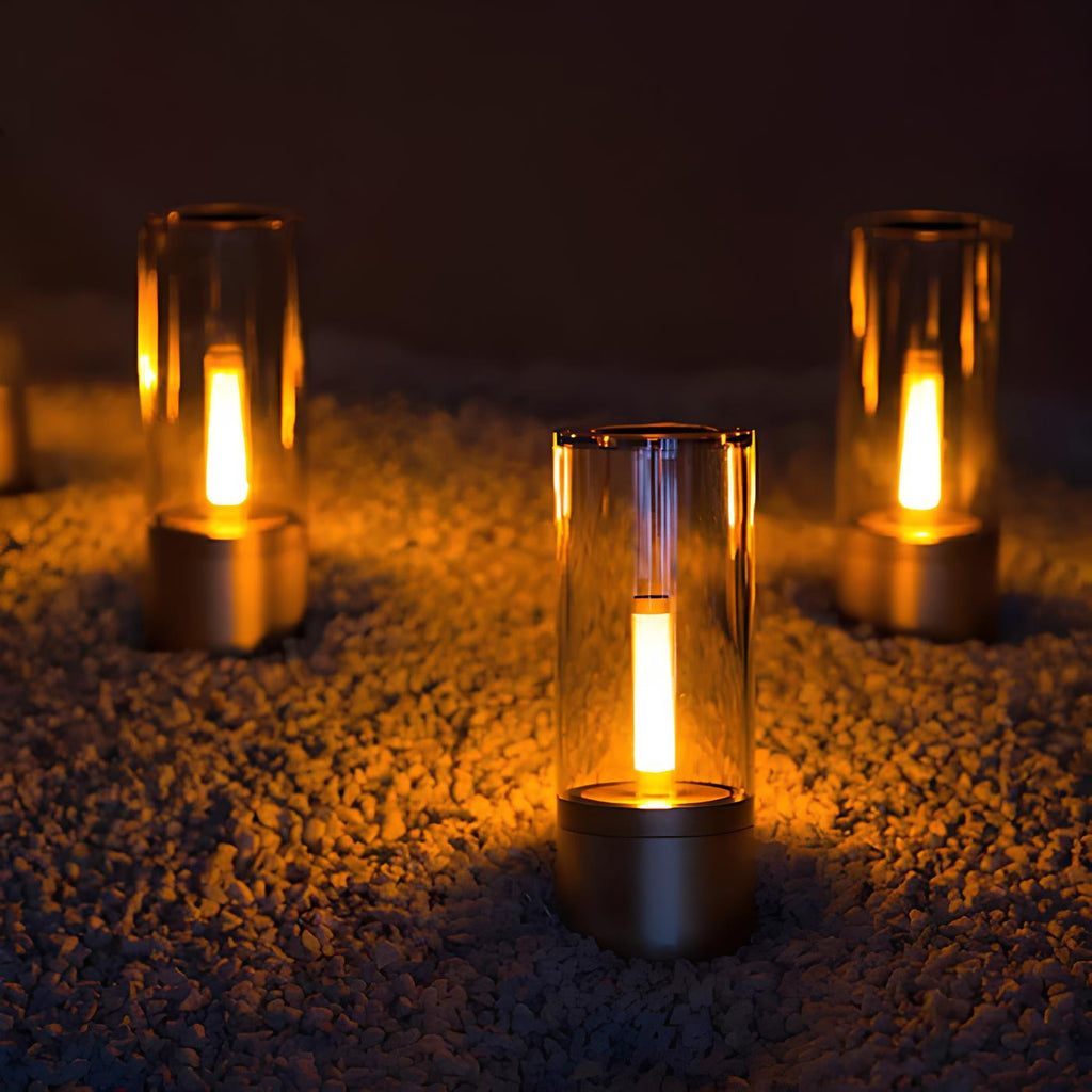 Dimmable cylindrical table lamp with clear glass body and warm white light glow 4