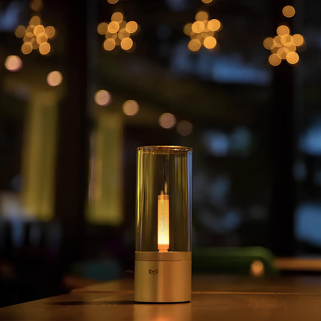 Dimmable cylindrical table lamp with clear glass body and warm white light glow 5