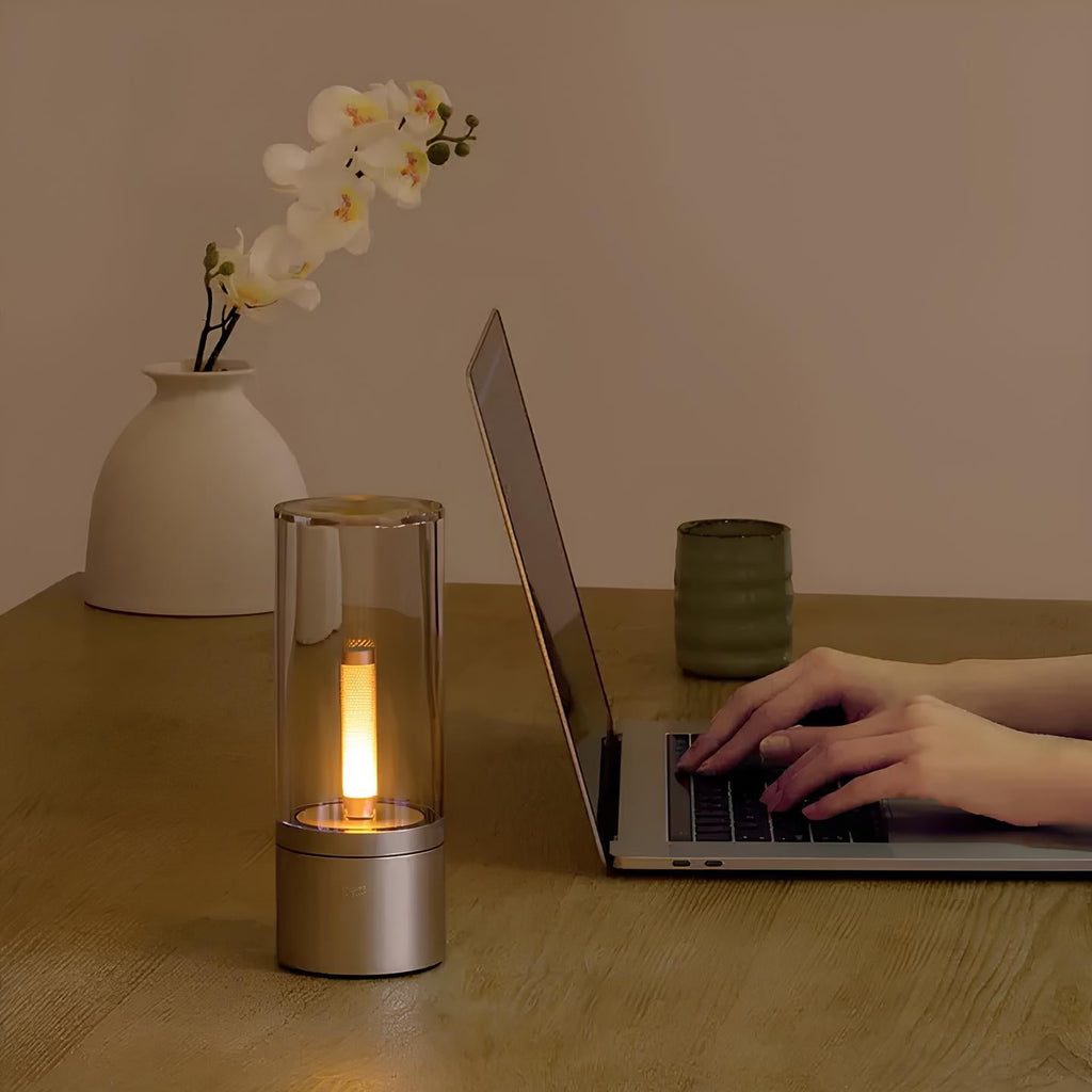 Dimmable cylindrical table lamp with clear glass body and warm white light glow 7