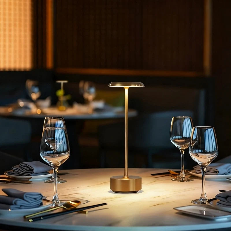Dimmable Luxora table lamp with sleek disc head and cylindrical aluminium base, modern minimalist design 3