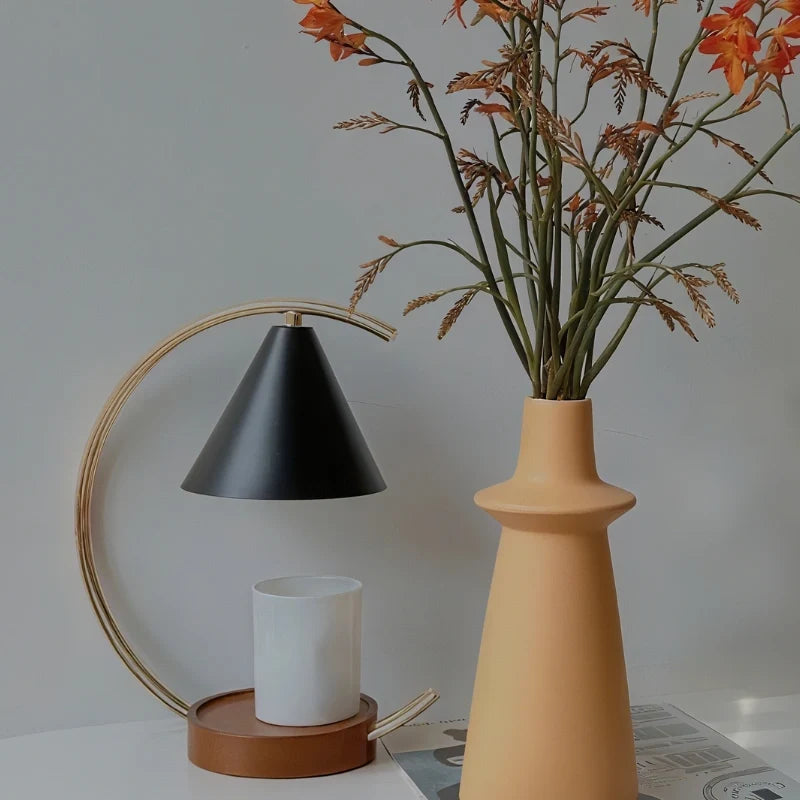 Dimmable Moonveil wax warmer lamp with natural wood base, arched iron frame, and warm white dimmable light 12