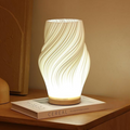 Dimmable Serene Wavecrest Lamp with wave-shaped shade and wooden base