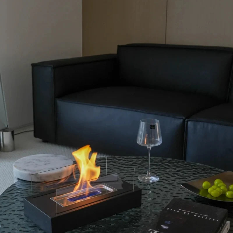 Elegant tabletop fireplace with tempered glass panels and metal base showcasing real flame ambiance 13