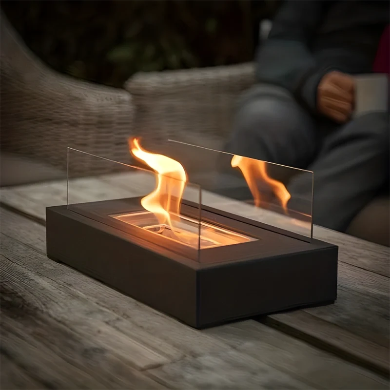 Elegant tabletop fireplace with tempered glass panels and metal base showcasing real flame ambiance 9