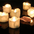 Flickering LED flameless candles with realistic flame effect in warm white, cool white, and yellow colors