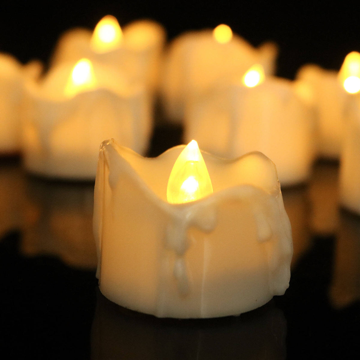 Flickering LED flameless candles with realistic flame effect in warm white, cool white, and yellow colors 3