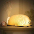 Foldable LumiFold portable LED book lamp with warm white light and 360-degree adjustable design