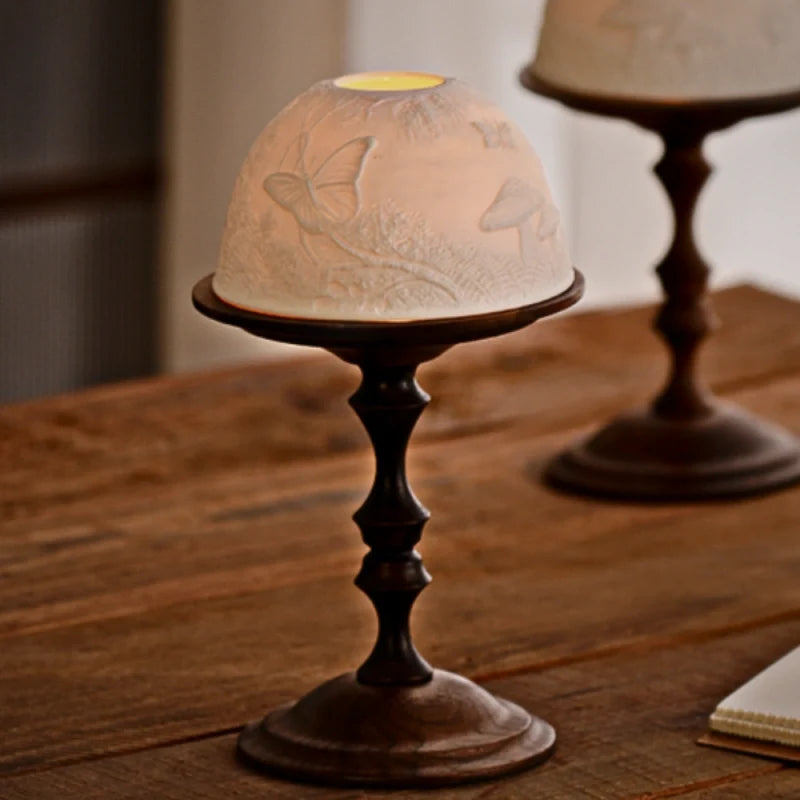 Hand-carved porcelain WhisperDome candle holder with walnut wood base, featuring nature relief design and warm candlelig 6