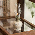 Handcrafted ceramic oil lantern with adjustable flame control and hand-finished base