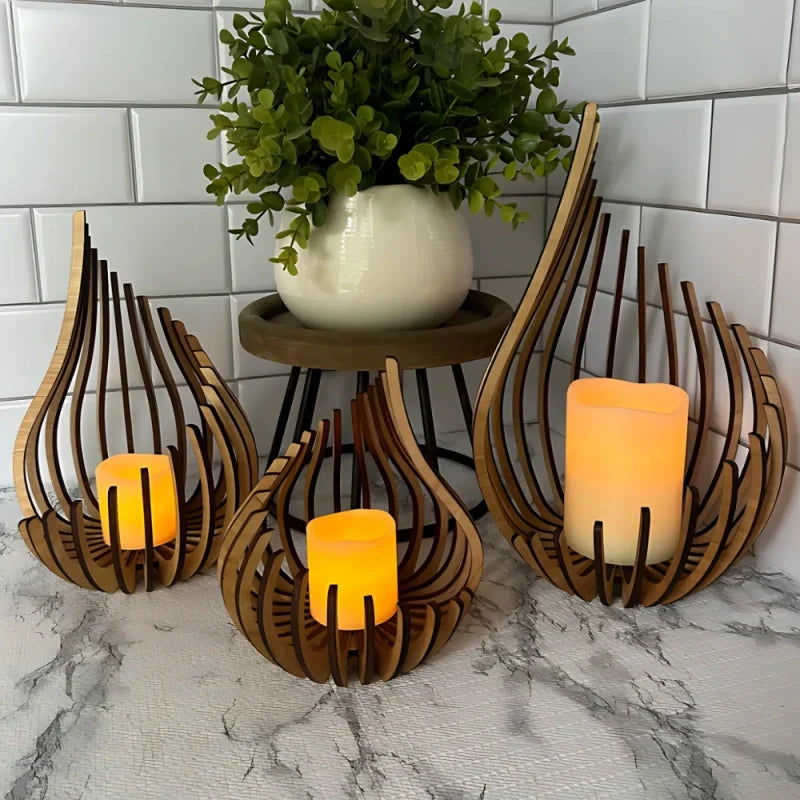 Handcrafted teardrop wooden candle holder with hollow design casting delicate shadows, available in small, medium, and l