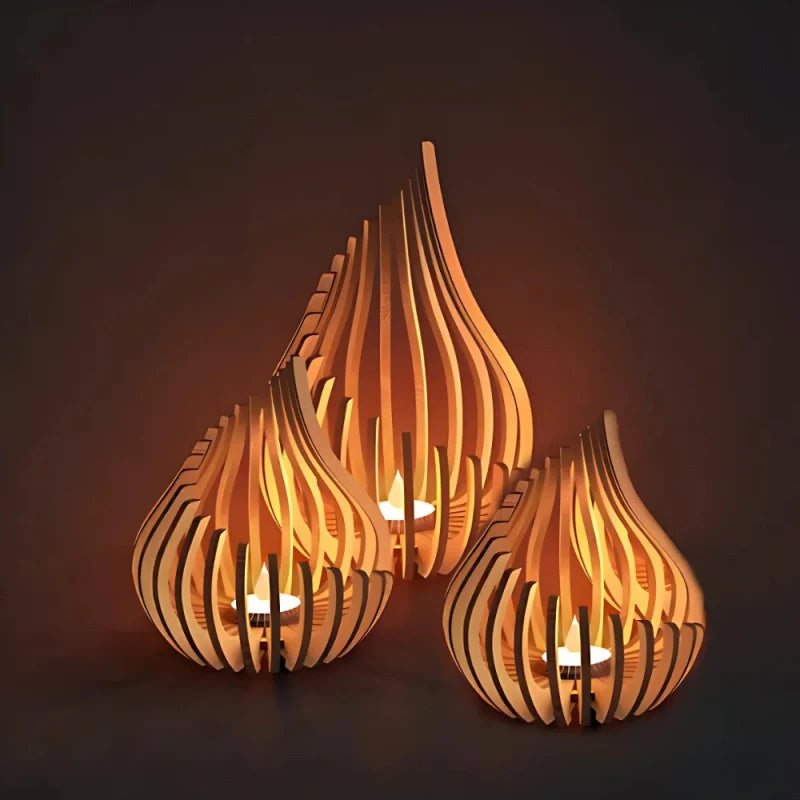 Handcrafted teardrop wooden candle holder with hollow design casting delicate shadows, available in small, medium, and l 6