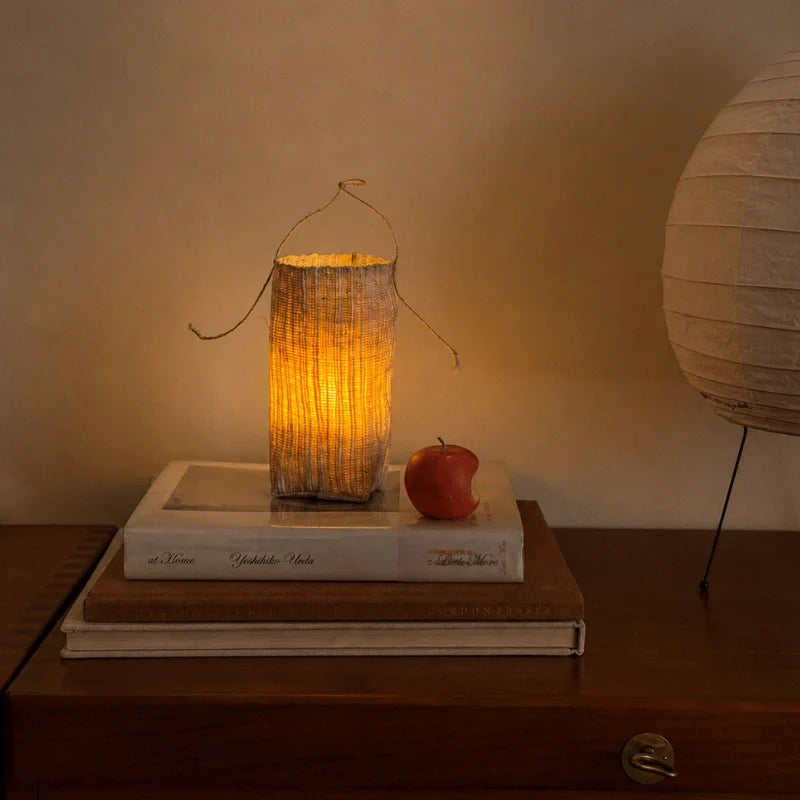Handwoven natural fiber lantern with warm white flickering light and handle for display 10