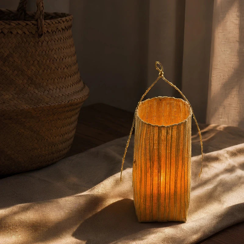 Handwoven natural fiber lantern with warm white flickering light and handle for display 12