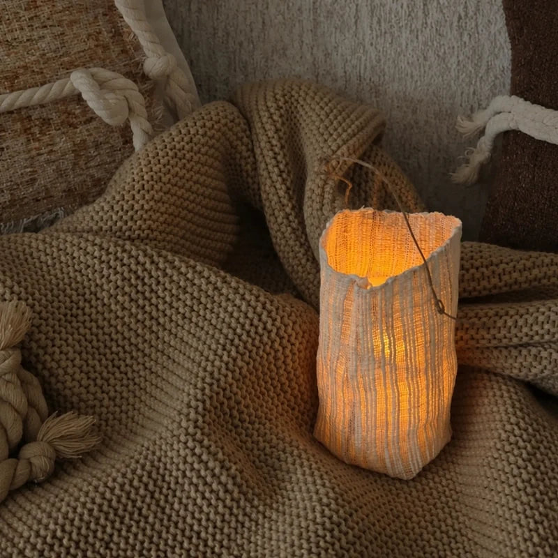 Handwoven natural fiber lantern with warm white flickering light and handle for display 13